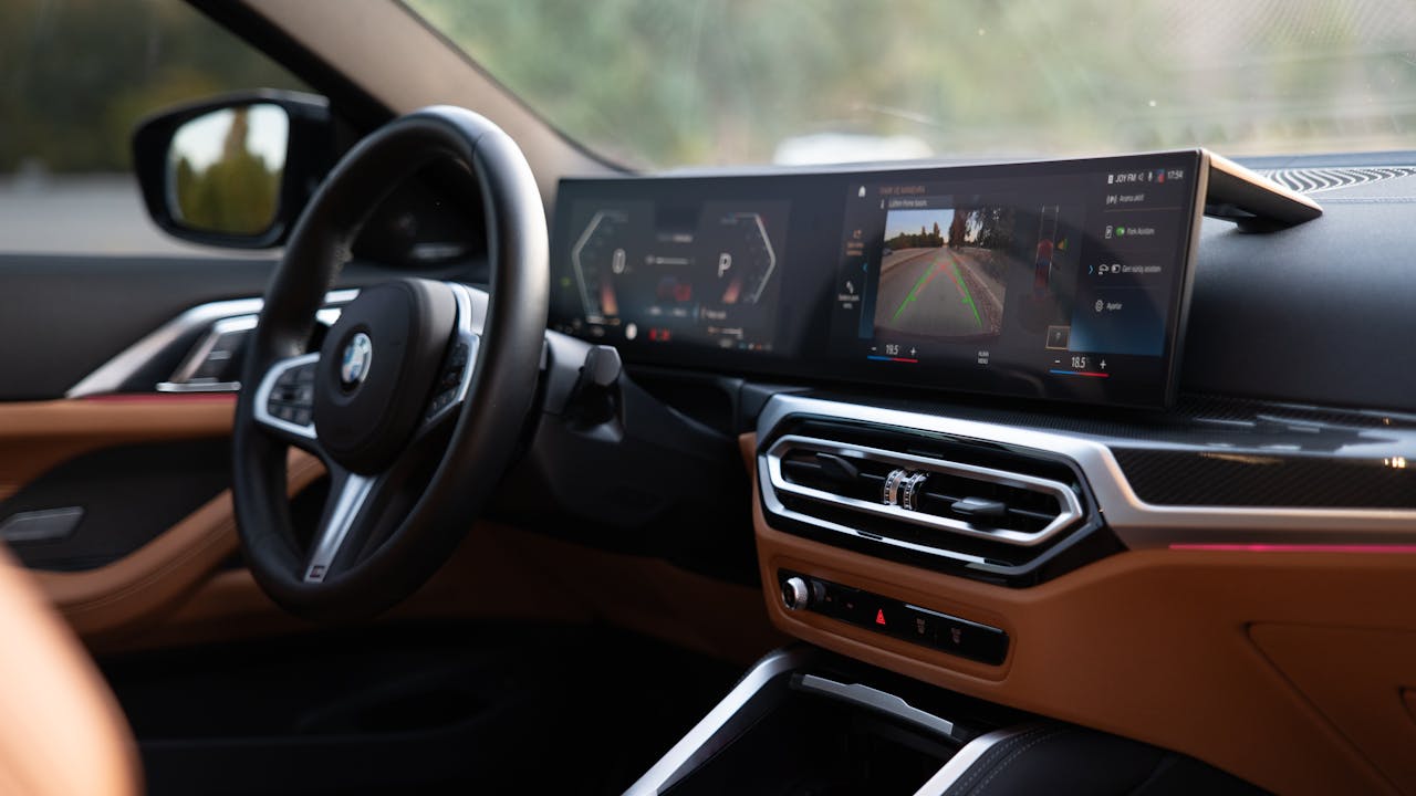 Explore the sleek design and advanced technology in this BMW car interior, showcasing a modern digital dashboard.